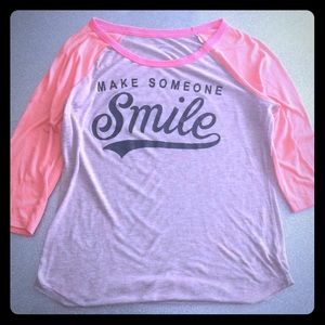 Baseball tee with quarter length sleeve.